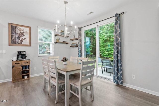 320 Everly Mist Way, Wake Forest, NC 27587 - dining room featuring a chandelier, wood finished floors, and baseboards