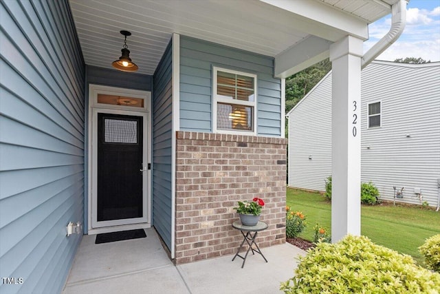 320 Everly Mist Way, Wake Forest, NC 27587 - view of exterior entry with brick siding and a porch