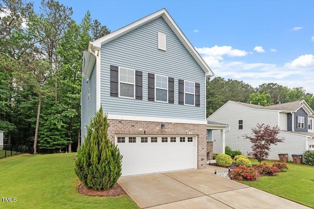 320 Everly Mist Way, Wake Forest, NC 27587 - view of front of property with brick siding, concrete driveway, an attached garage, and a front yard