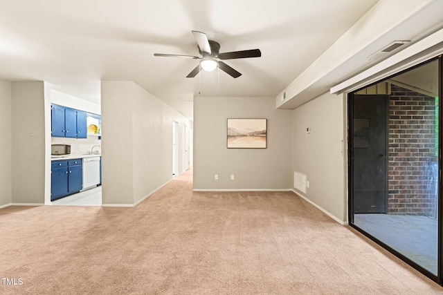 unfurnished room featuring light carpet, ceiling fan, and baseboards