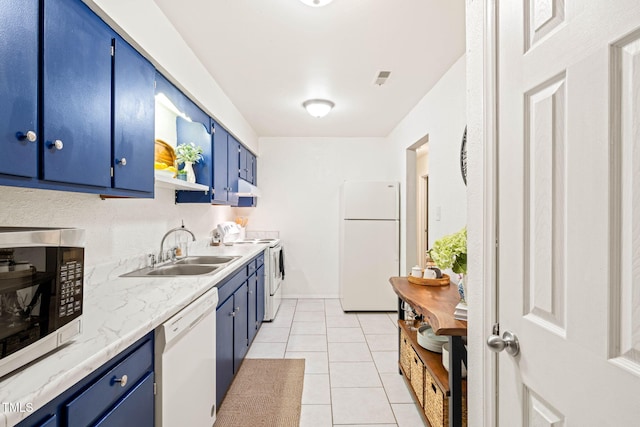 kitchen featuring blue cabinets, white appliances, a sink, and light countertops