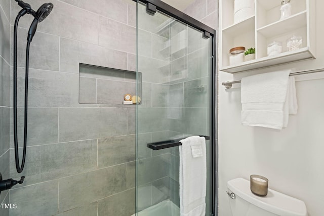 full bath with toilet and a shower stall