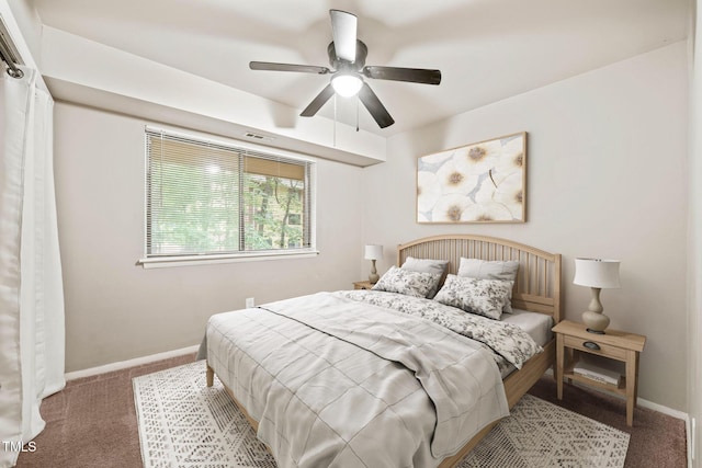 carpeted bedroom with baseboards and ceiling fan