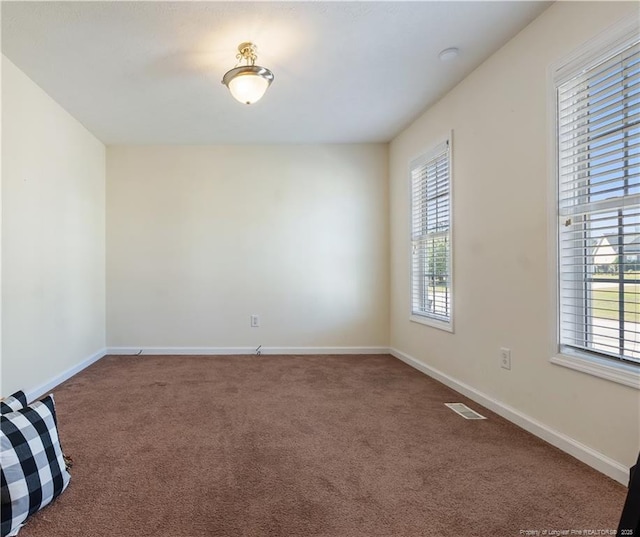 9012 Grouse Run Ln, Fayetteville, NC 28314 - carpeted spare room featuring plenty of natural light and baseboards
