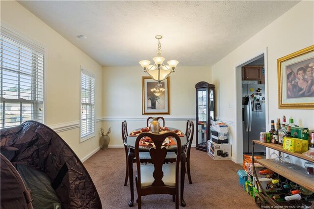 9012 Grouse Run Ln, Fayetteville, NC 28314 - carpeted dining space featuring a chandelier and baseboards