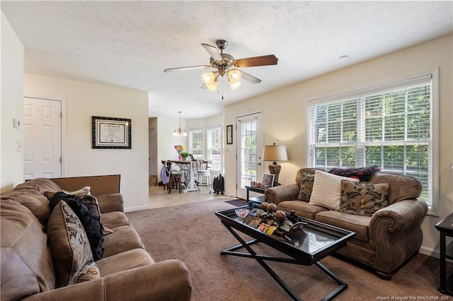 9012 Grouse Run Ln, Fayetteville, NC 28314 - carpeted living area with a ceiling fan, healthy amount of natural light, and baseboards