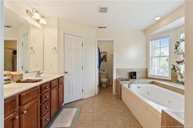 9012 Grouse Run Ln, Fayetteville, NC 28314 - full bath with toilet, tile patterned floors, double vanity, and a whirlpool tub