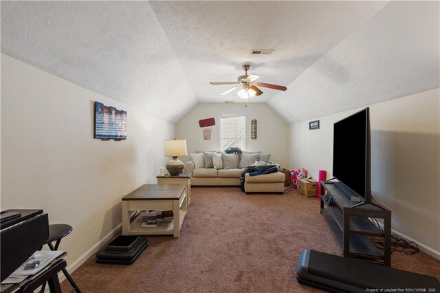 9012 Grouse Run Ln, Fayetteville, NC 28314 - carpeted living area featuring vaulted ceiling, ceiling fan, baseboards, and a textured ceiling