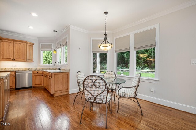 8420 Caldbeck Dr, Raleigh, NC 27615 - dining area with plenty of natural light, ornamental molding, baseboards, wood finished floors, and recessed lighting
