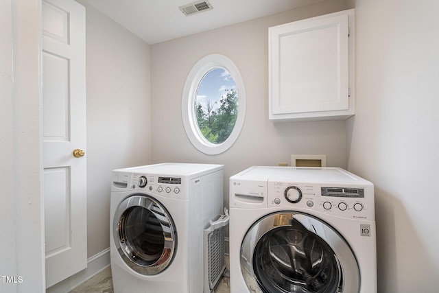 8420 Caldbeck Dr, Raleigh, NC 27615 - laundry room with washer and clothes dryer, cabinet space, and baseboards