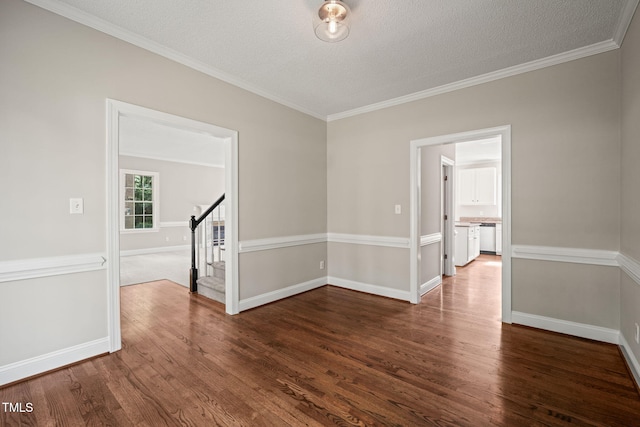1005 Barmkin Pl, Knightdale, NC 27545 - spare room featuring stairway, dark wood finished floors, baseboards, ornamental molding, and a textured ceiling