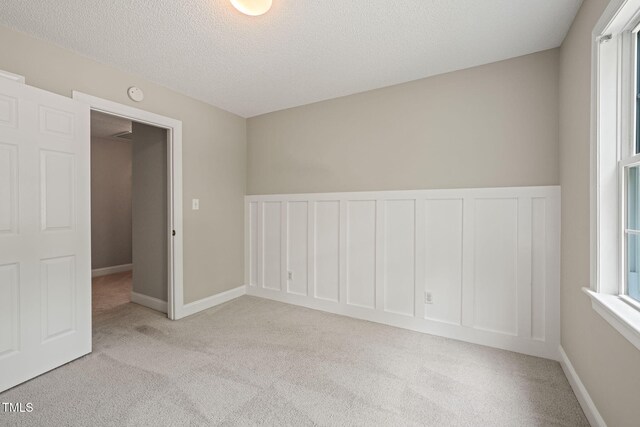 1005 Barmkin Pl, Knightdale, NC 27545 - carpeted spare room featuring a textured ceiling
