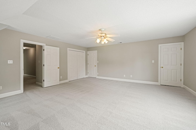 1005 Barmkin Pl, Knightdale, NC 27545 - unfurnished bedroom with light carpet, baseboards, and ceiling fan