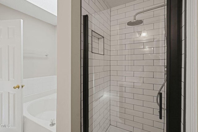 1005 Barmkin Pl, Knightdale, NC 27545 - bathroom with a stall shower and a bath