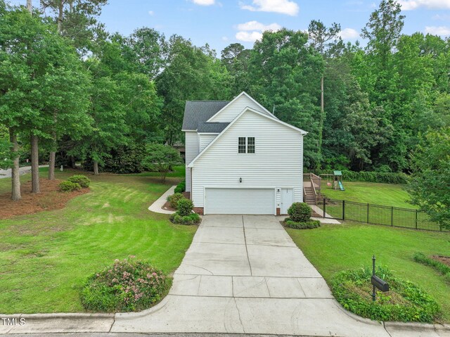 1005 Barmkin Pl, Knightdale, NC 27545 - view of property exterior featuring an attached garage, concrete driveway, and stairway