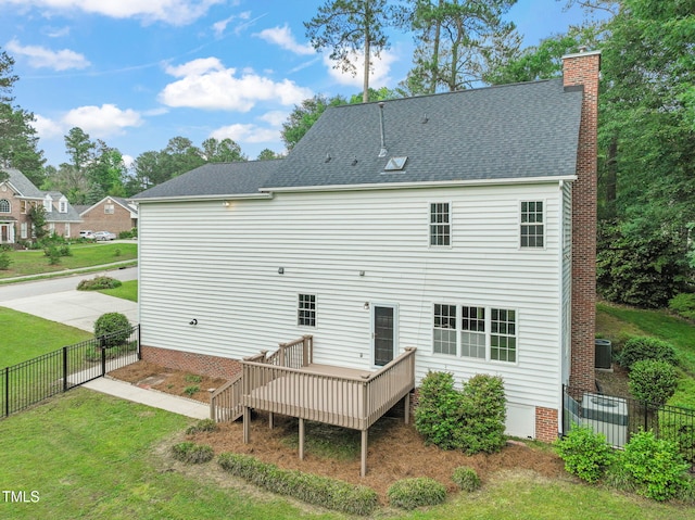 1005 Barmkin Pl, Knightdale, NC 27545 - rear view of property with a wooden deck, a chimney, and roof with shingles
