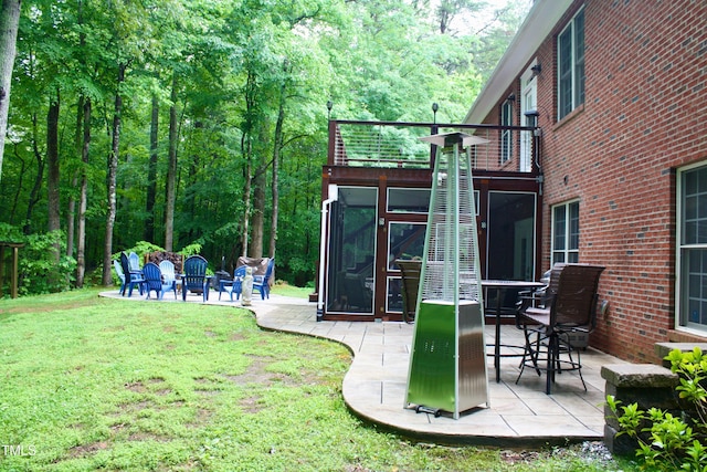 3750 Mebane Rogers Rd, Mebane, NC 27302 - view of green lawn with a balcony and a patio area