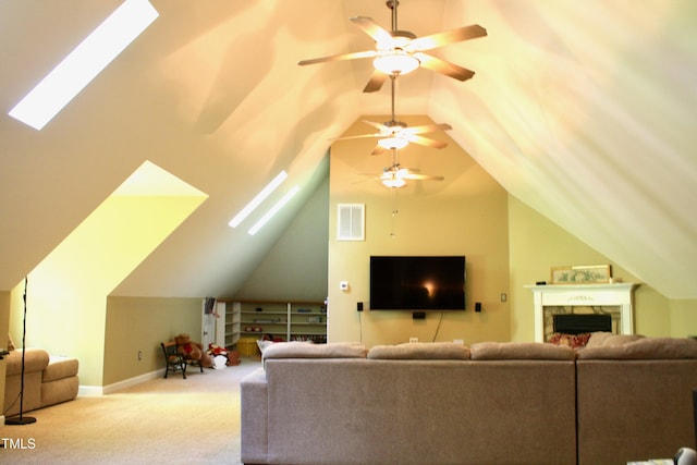 3750 Mebane Rogers Rd, Mebane, NC 27302 - carpeted living room with a skylight, a ceiling fan, vaulted ceiling, and a premium fireplace