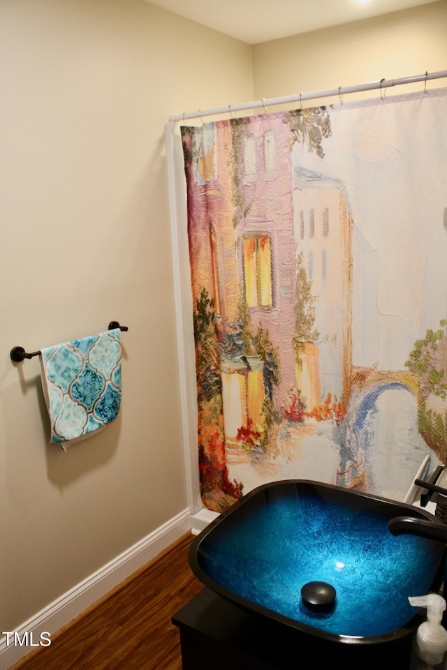3750 Mebane Rogers Rd, Mebane, NC 27302 - bathroom featuring wood finished floors, baseboards, and a shower with curtain