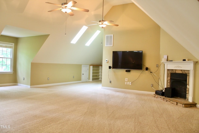 3750 Mebane Rogers Rd, Mebane, NC 27302 - unfurnished living room featuring ceiling fan, a skylight, carpet, and vaulted ceiling