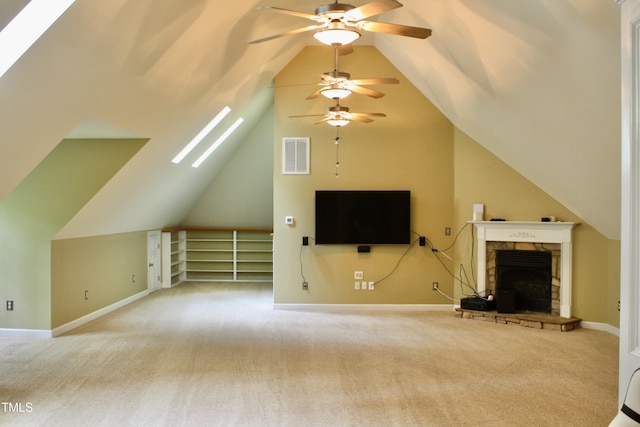 3750 Mebane Rogers Rd, Mebane, NC 27302 - unfurnished living room featuring a skylight, ceiling fan, carpet floors, lofted ceiling, and a fireplace