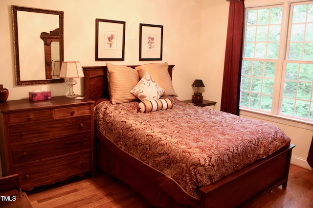 3750 Mebane Rogers Rd, Mebane, NC 27302 - bedroom with wood finished floors and multiple windows