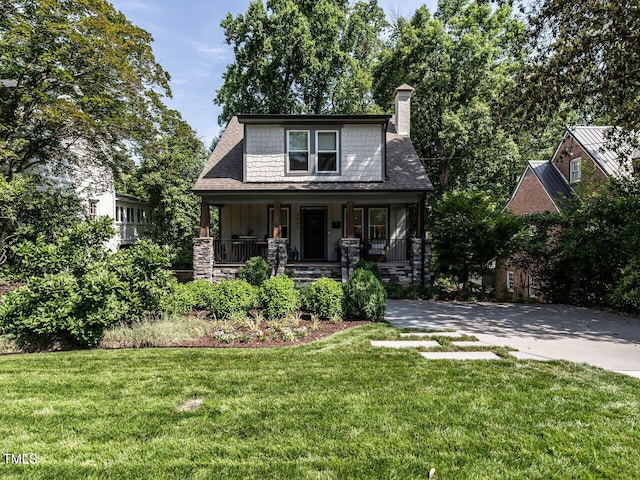 2303 Byrd St, Raleigh, NC 27608 - view of front of property featuring a porch, a chimney, a front lawn, and board and batten siding