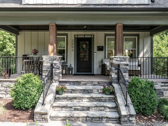 2303 Byrd St, Raleigh, NC 27608 - view of exterior entry featuring a porch and board and batten siding