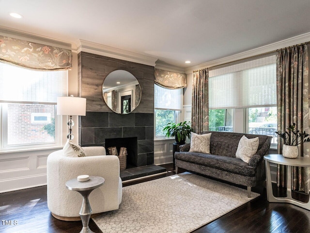2303 Byrd St, Raleigh, NC 27608 - living area with ornamental molding, wood finished floors, a fireplace, and a decorative wall
