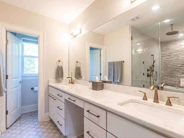 2303 Byrd St, Raleigh, NC 27608 - full bath with tile patterned floors, double vanity, and a shower stall