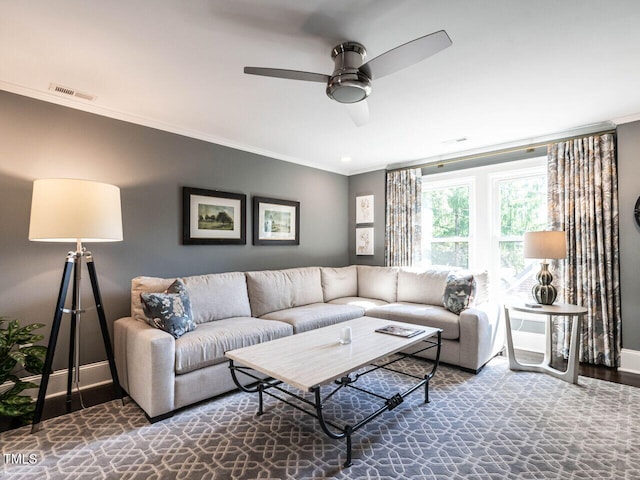 2303 Byrd St, Raleigh, NC 27608 - living area featuring crown molding, baseboards, and a ceiling fan
