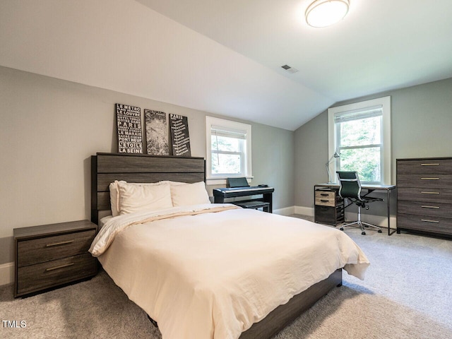 2303 Byrd St, Raleigh, NC 27608 - bedroom with carpet flooring, vaulted ceiling, multiple windows, and baseboards