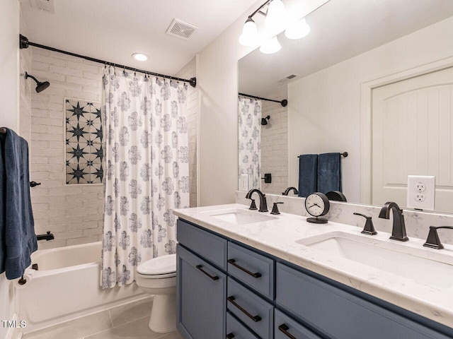 2303 Byrd St, Raleigh, NC 27608 - full bathroom with shower / bath combo, tile patterned floors, double vanity, and toilet