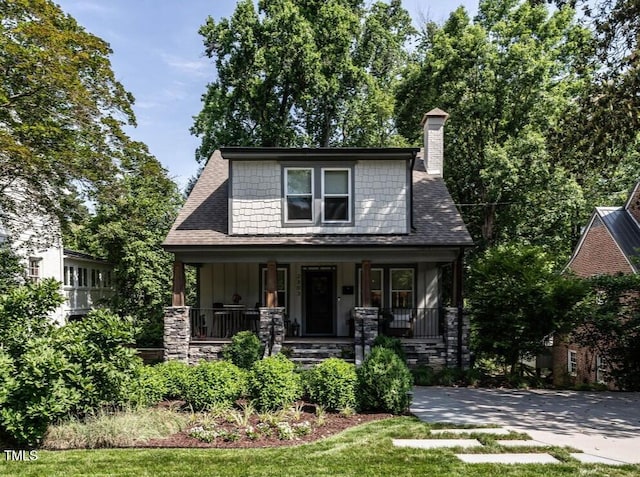 2303 Byrd St, Raleigh, NC 27608 - view of front facade with a chimney, covered porch, and a front yard