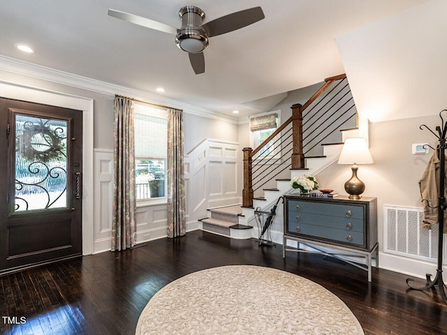 2303 Byrd St, Raleigh, NC 27608 - foyer entrance with hardwood / wood-style floors, stairway, a decorative wall, ceiling fan, and a wainscoted wall