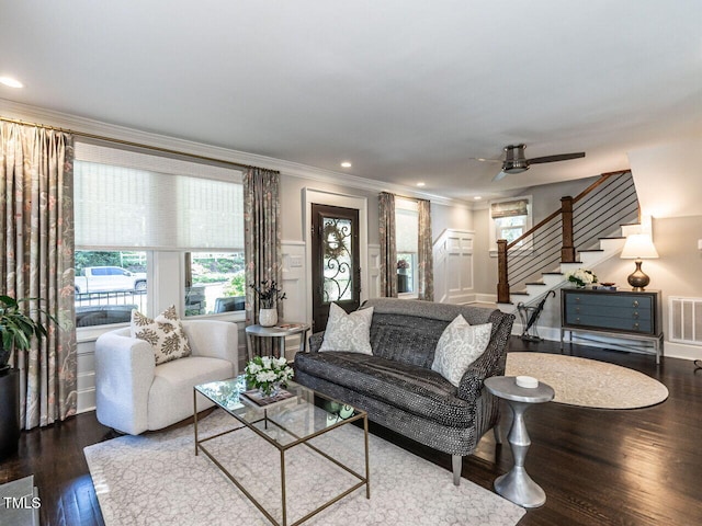2303 Byrd St, Raleigh, NC 27608 - living area with ornamental molding, stairway, plenty of natural light, wood finished floors, and recessed lighting