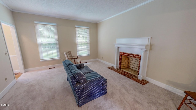 living area featuring carpet flooring, crown molding, a textured ceiling, baseboards, and a fireplace with flush hearth