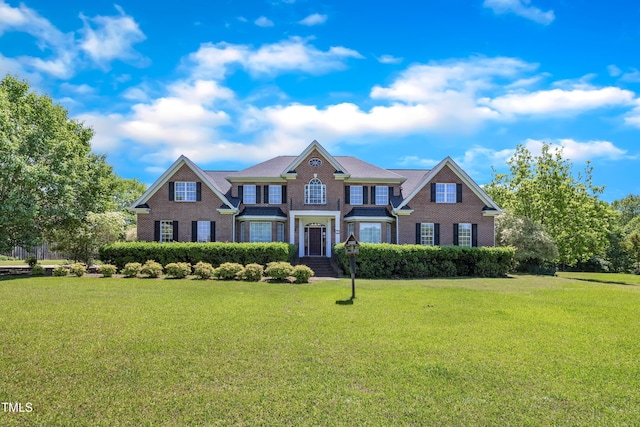 107 Stargrass Ave, Clayton, NC 27527 - view of front facade featuring brick siding and a front lawn