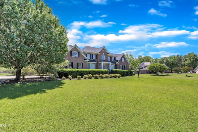 107 Stargrass Ave, Clayton, NC 27527 - view of front of home with a front yard and brick siding