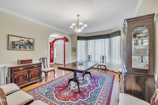 107 Stargrass Ave, Clayton, NC 27527 - home office with arched walkways, ornamental molding, a chandelier, light wood-type flooring, and wainscoting