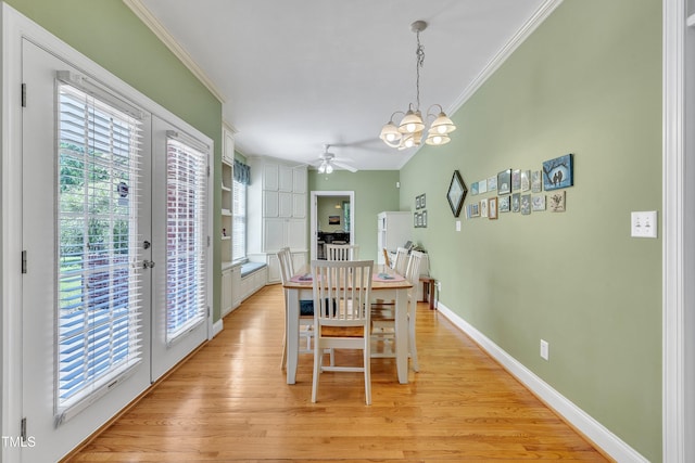 107 Stargrass Ave, Clayton, NC 27527 - dining area featuring ornamental molding, a chandelier, light wood-style floors, ceiling fan, and baseboards