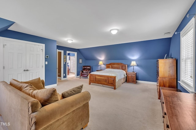 107 Stargrass Ave, Clayton, NC 27527 - bedroom with carpet, baseboards, vaulted ceiling, and a closet