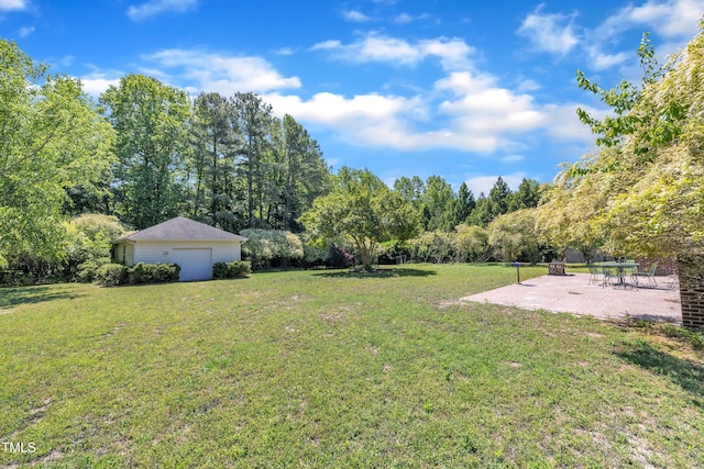 107 Stargrass Ave, Clayton, NC 27527 - view of green lawn featuring a patio area, an outbuilding, and a detached garage