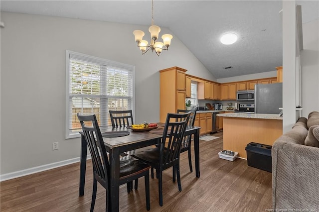 dining space with a chandelier, dark wood-type flooring, baseboards, and high vaulted ceiling