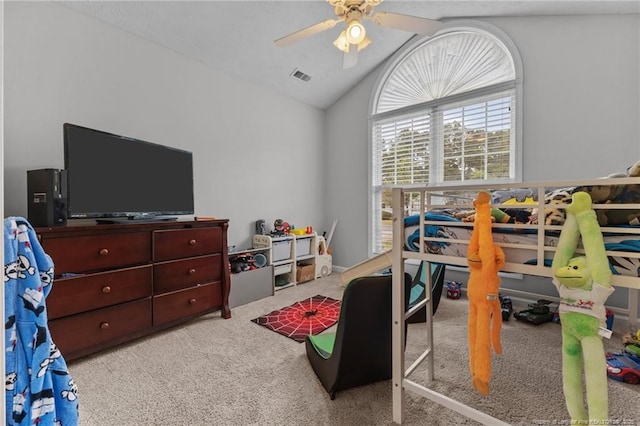 bedroom with carpet, vaulted ceiling, and ceiling fan