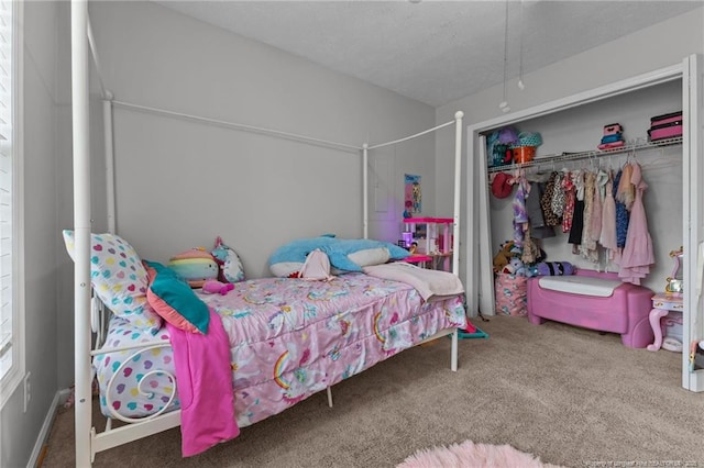 carpeted bedroom featuring a closet