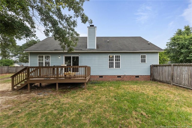 rear view of property featuring crawl space, a deck, and a chimney