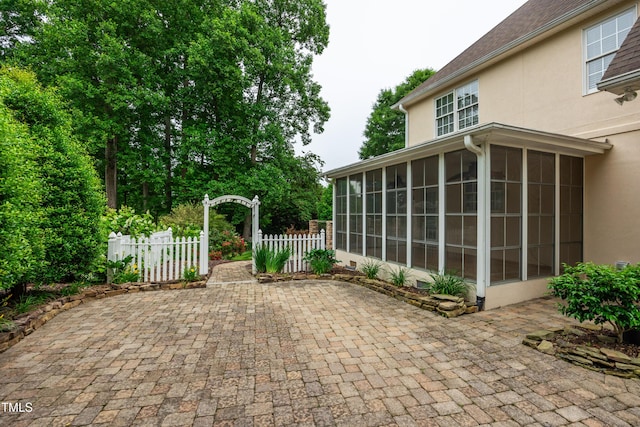 608 Greyrock Rd, Whitsett, NC 27377 - view of patio / terrace featuring a sunroom