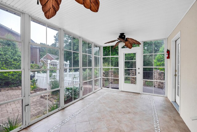 608 Greyrock Rd, Whitsett, NC 27377 - unfurnished sunroom featuring a ceiling fan