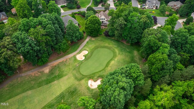 608 Greyrock Rd, Whitsett, NC 27377 - aerial view of property and surrounding area featuring nearby suburban area, a golf club, and a tree filled landscape